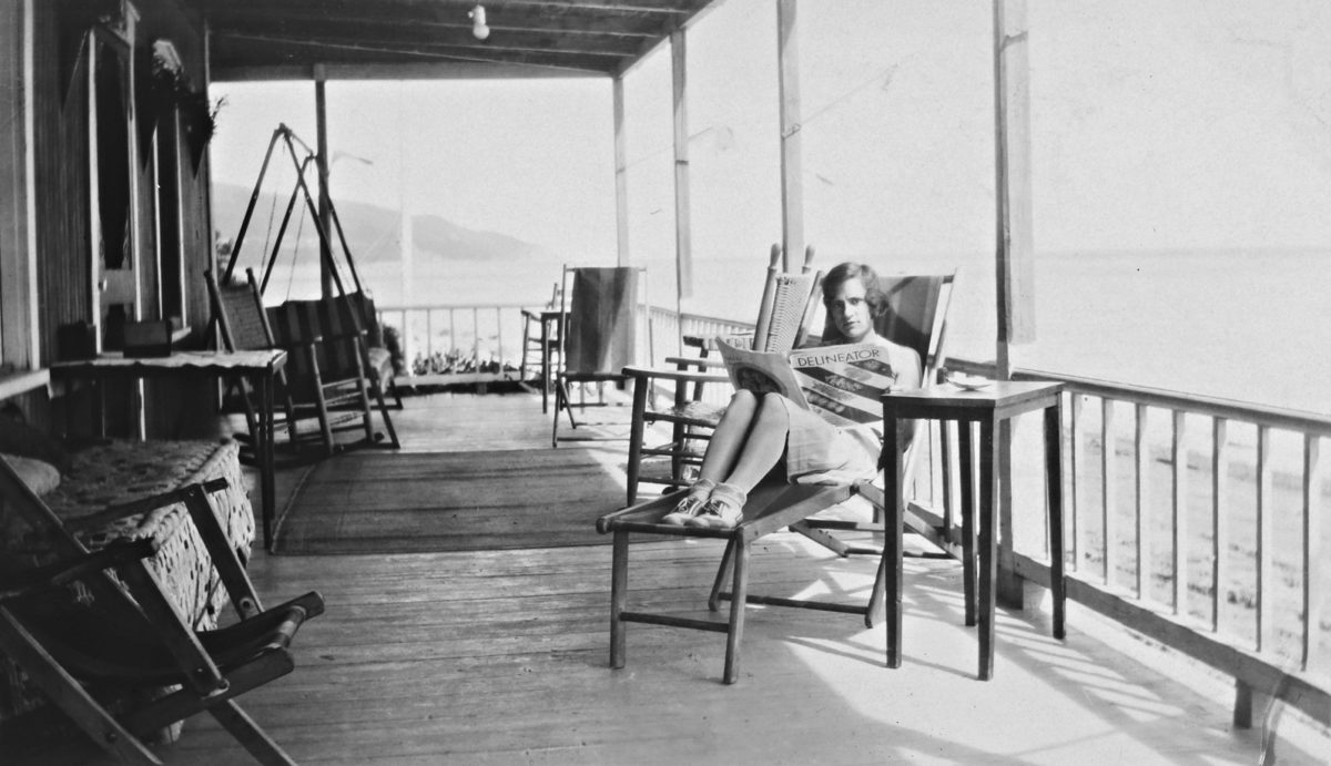 <i>“On vacation at the cottage O.K.”: Gilberte Christin on the veranda, Les Éboulements, Quebec</i>, 1930. Gift of the Cardaillac family, M2001.8.35.235, McCord Museum