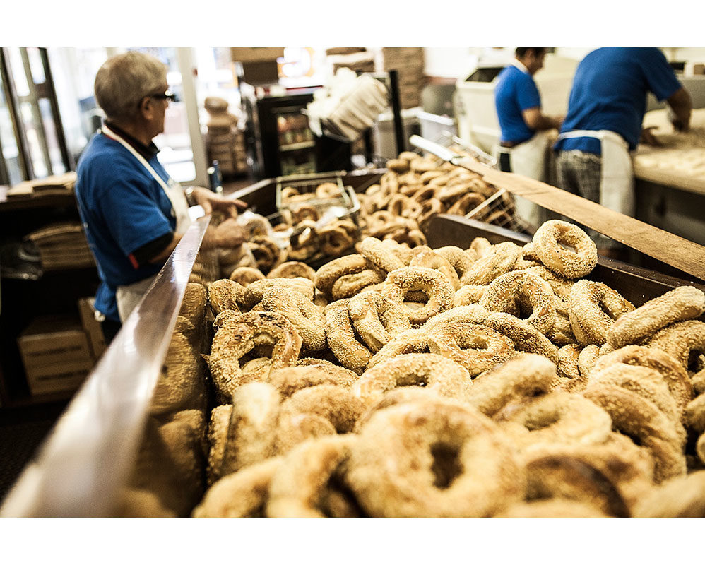 David De Stefano, <i>Dipping bagels in sesame seeds, St-Viateur Bagel</i>, Montreal, 2012. Courtesy of St-Viateur Bagel