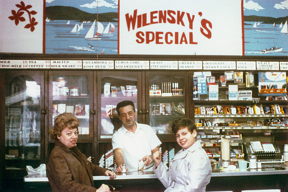 Anonymous, <i>Moe Wilensky and customers</i>, Montreal, 1965. Courtesy of the Wilensky family