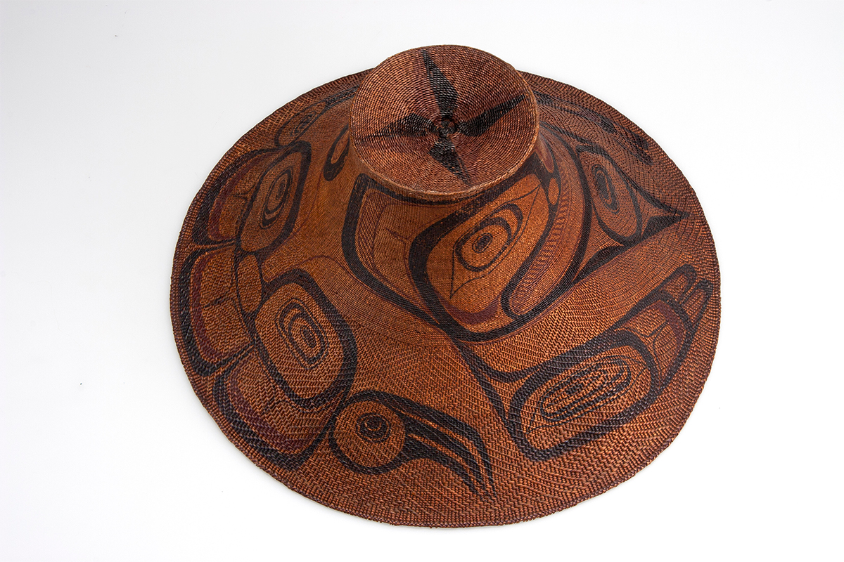 Painted basketry hat, 1875-1900. Woven by Isabella Edenshaw (K’woiyang) (about 1858-1926) and painted by Charles Edenshaw (Tahayghen) (about 1839-1920). Spruce root and bark, paint. Collected by George Mercer Dawson. Gift of Mrs. William Markland Molson.  ME928.57.3 © McCord Museum 