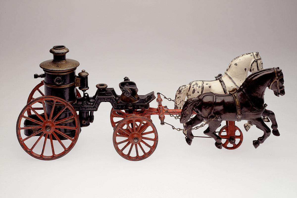 <i>Model fire engine</i>, about 1890. Gift of Mr. R. H. Gaunt, M969.22.14.1-4 © McCord Museum
